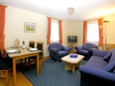 Ein Sitzbereich in der Unterkunft Apartment FEWO Geranie by Interhome