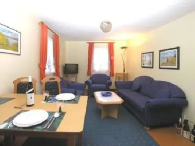 Ein Sitzbereich in der Unterkunft Apartment FEWO Geranie by Interhome