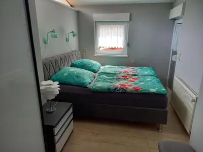 Ein Bett oder Betten in einem Zimmer der Unterkunft Holiday Home in Im Trieschelbach mit Großem Garten by Interhome