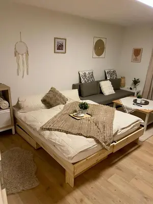 Ein Bett oder Betten in einem Zimmer der Unterkunft FeWo Zum Preussensteig Fröhwaldstraße 19 max 5 Gäste