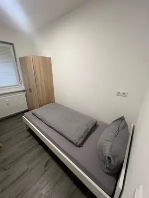 Ein Bett oder Betten in einem Zimmer der Unterkunft Häusliche Wohnung in Koblenz WE15