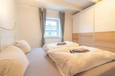Ein Bett oder Betten in einem Zimmer der Unterkunft Charmantes Tiny House in Güls