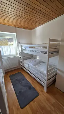 Ein Bett oder Betten in einem Zimmer der Unterkunft Ferienhaus check ferien dot world