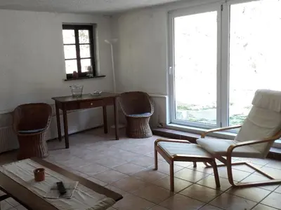 Ein Sitzbereich in der Unterkunft Main building Neumühle