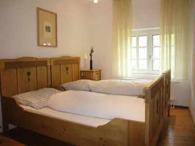 Ein Bett oder Betten in einem Zimmer der Unterkunft Ambiente WeinStein am Doctorberg