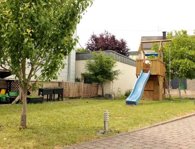 Ein Kinderspielbereich in der Unterkunft Ferienwohnungen Weingut Breit