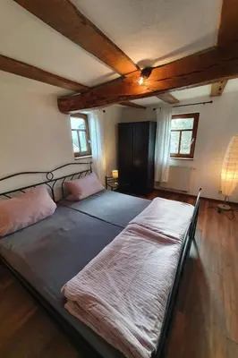 Ein Bett oder Betten in einem Zimmer der Unterkunft Holiday Home Romantisches Fachwerkhaus zwischen Rhein und Mosel by Interhome