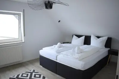 Ein Bett oder Betten in einem Zimmer der Unterkunft Ferienwohnung Emmerich