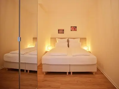 Ein Bett oder Betten in einem Zimmer der Unterkunft Marx - Modernes Apartment - Top Lage im Zentrum - Gratis WLAN - ideal für Geschäftsreisende & Paare