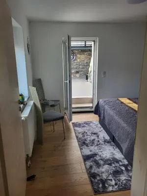 Ein Bett oder Betten in einem Zimmer der Unterkunft Ferienhaus Neunkirchen-Daun