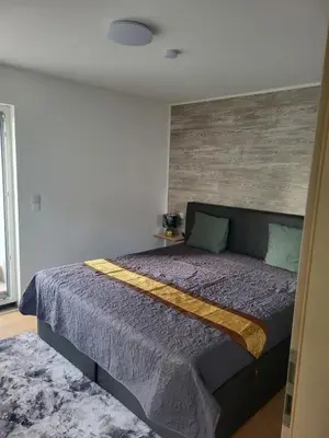 Ein Bett oder Betten in einem Zimmer der Unterkunft Ferienhaus Neunkirchen-Daun