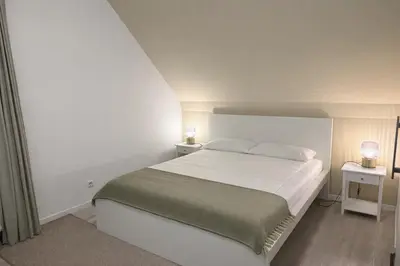 Ein Bett oder Betten in einem Zimmer der Unterkunft Rhein Lahn Hotel
