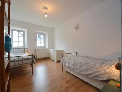 Ein Bett oder Betten in einem Zimmer der Unterkunft Veltenhaus Historic Retreat