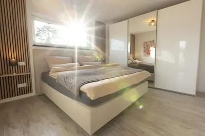 Ein Bett oder Betten in einem Zimmer der Unterkunft Exklusive Ferienwohnung in Kottenheim am Laacher See