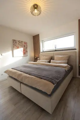 Ein Bett oder Betten in einem Zimmer der Unterkunft Exklusive Ferienwohnung in Kottenheim am Laacher See