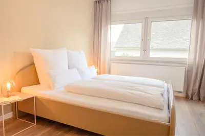 Ein Bett oder Betten in einem Zimmer der Unterkunft Hofgut Eveshausen - Familienquartier Klassik