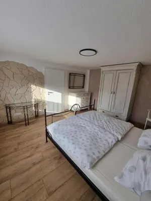 Ein Bett oder Betten in einem Zimmer der Unterkunft Ferienwohnung Braun