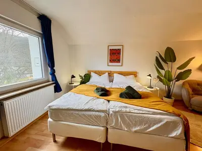 Ein Bett oder Betten in einem Zimmer der Unterkunft Townhaus Mariaroth