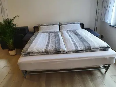 Ein Bett oder Betten in einem Zimmer der Unterkunft Holiday apartment in Moselkern with barbecue