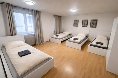 Ein Bett oder Betten in einem Zimmer der Unterkunft Ehrenbreitstein Apartment Perfect for Workers & Groups
