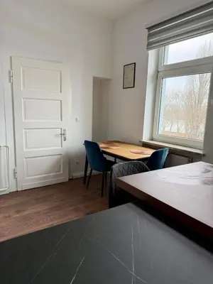 Ein Bett oder Betten in einem Zimmer der Unterkunft Stilvolle Wohnung mit Rheinblick