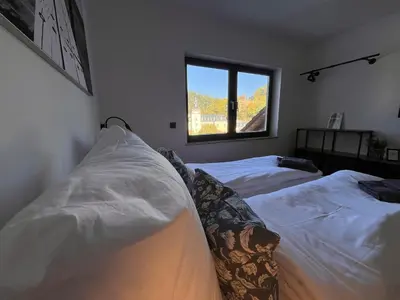 Ein Bett oder Betten in einem Zimmer der Unterkunft Ferienwohnung Sayntal - Blick auf Schloss Sayn