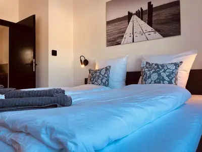 Ein Bett oder Betten in einem Zimmer der Unterkunft Ferienwohnung Sayntal - Blick auf Schloss Sayn