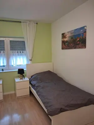 Ein Bett oder Betten in einem Zimmer der Unterkunft Ferienwohnung Stefanie OG