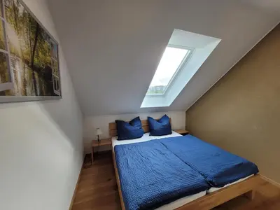 Ein Bett oder Betten in einem Zimmer der Unterkunft Ferienwohnung Weitblick