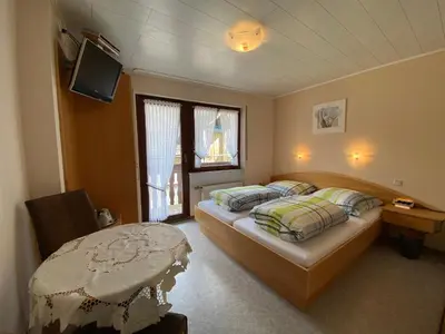 Ein Bett oder Betten in einem Zimmer der Unterkunft Gästehaus im Oberdorf