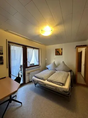 Ein Bett oder Betten in einem Zimmer der Unterkunft Gästehaus im Oberdorf