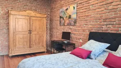 Ein Bett oder Betten in einem Zimmer der Unterkunft Loft am Airport Hahn
