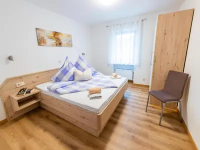 Ein Bett oder Betten in einem Zimmer der Unterkunft Ferienwohnung Weingut Thielen-Nilles