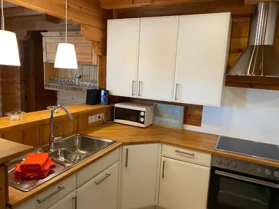 Küche/Küchenzeile in der Unterkunft Holiday Home Chalet mit Garten- Grill und Terrasse by Interhome