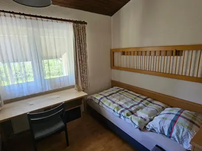 Ein Bett oder Betten in einem Zimmer der Unterkunft Holiday Home mit Garten im Naturpark Südeifel by Interhome