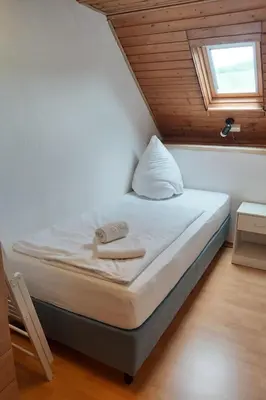 Ein Bett oder Betten in einem Zimmer der Unterkunft Holiday Home L by Interhome