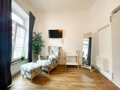 TV/Unterhaltungsangebot in der Unterkunft Ferienzimmer mit Küche mitten im Zentrum perfekt um die Stadt zu erkunden