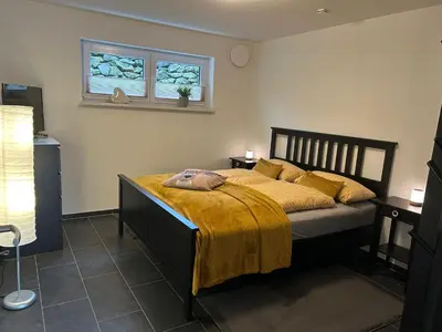 Ein Bett oder Betten in einem Zimmer der Unterkunft Ferienwohnung im Hasenwieschen