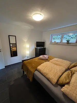 Ein Bett oder Betten in einem Zimmer der Unterkunft Ferienwohnung im Hasenwieschen