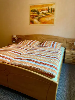 Ein Bett oder Betten in einem Zimmer der Unterkunft B&B Pension-Schönheim