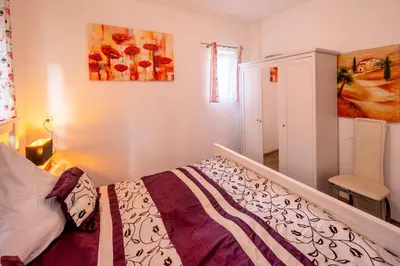 Ein Bett oder Betten in einem Zimmer der Unterkunft City Ferienhaus Vulkaneifel