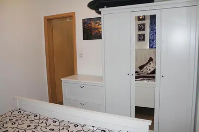 Ein Bett oder Betten in einem Zimmer der Unterkunft City Ferienhaus Vulkaneifel