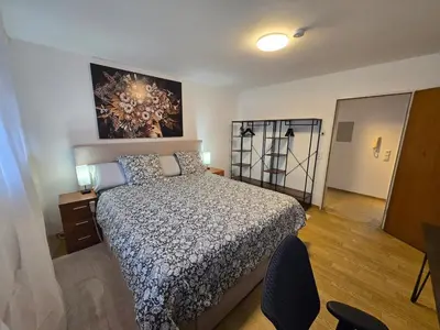 Ein Bett oder Betten in einem Zimmer der Unterkunft Tarforst Height Apartment, Trier