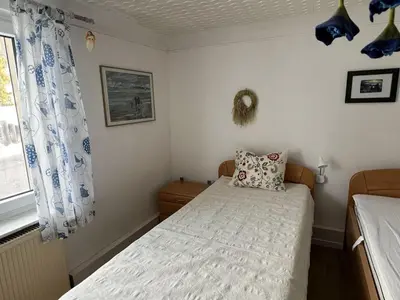 Ein Bett oder Betten in einem Zimmer der Unterkunft Haus InselZeit