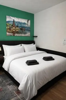 Ein Bett oder Betten in einem Zimmer der Unterkunft Eckblick Residence l Panorama Balkon