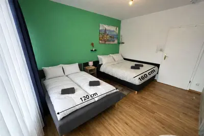 Ein Bett oder Betten in einem Zimmer der Unterkunft Eckblick Residence l Panorama Balkon