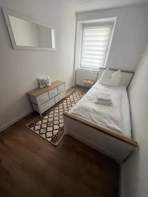 Ein Bett oder Betten in einem Zimmer der Unterkunft Lina Ferienhaus
