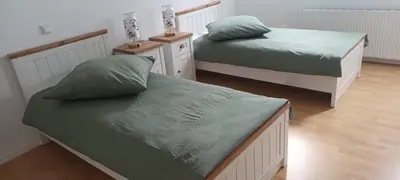 Ein Bett oder Betten in einem Zimmer der Unterkunft Kornkammer - Ferienhaus NaheZeit Bostalsee