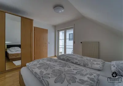 Ein Bett oder Betten in einem Zimmer der Unterkunft Gästehaus Lydia - Mühlenberg