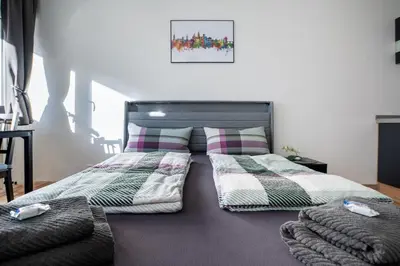 Ein Bett oder Betten in einem Zimmer der Unterkunft City-Apartment mit Parkplatz, Balkon und Küche